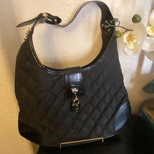 Black Burberry quilted nylon with leather trimming, gold hardware shoulder bag.